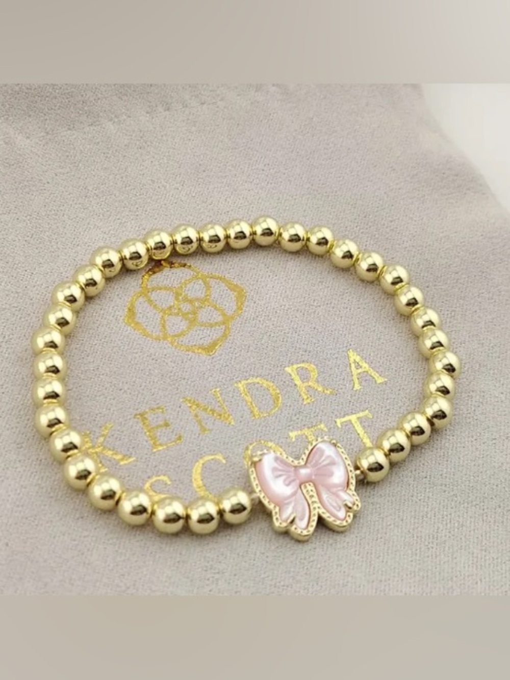 Kendra Scott Gold Beaded Bracelet with Pink Enamel Bow Charm